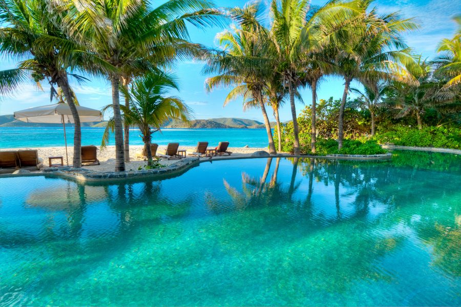 This is an image of private islands. Beach House on Necker Island