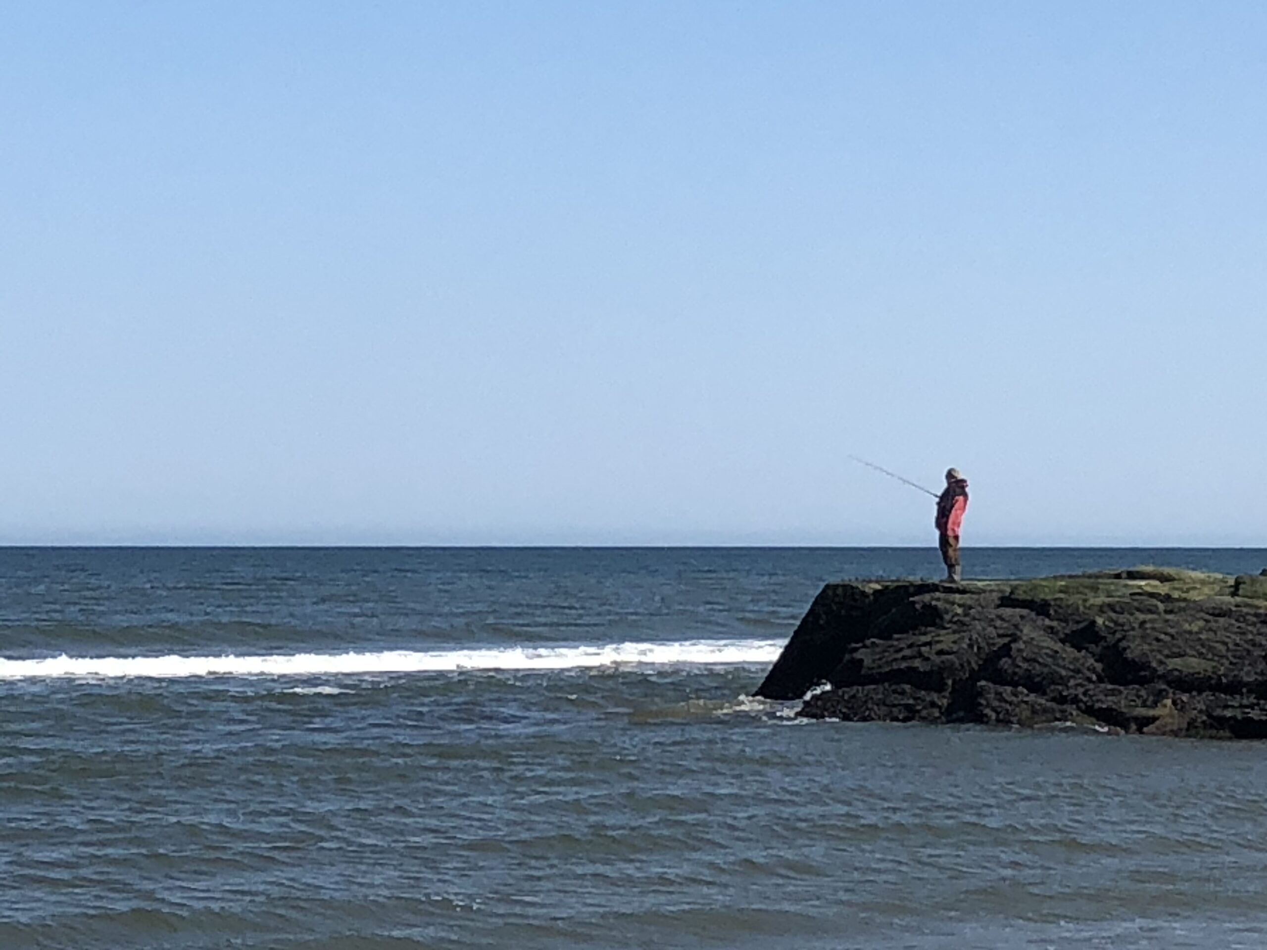 ocean grove beach man fishing