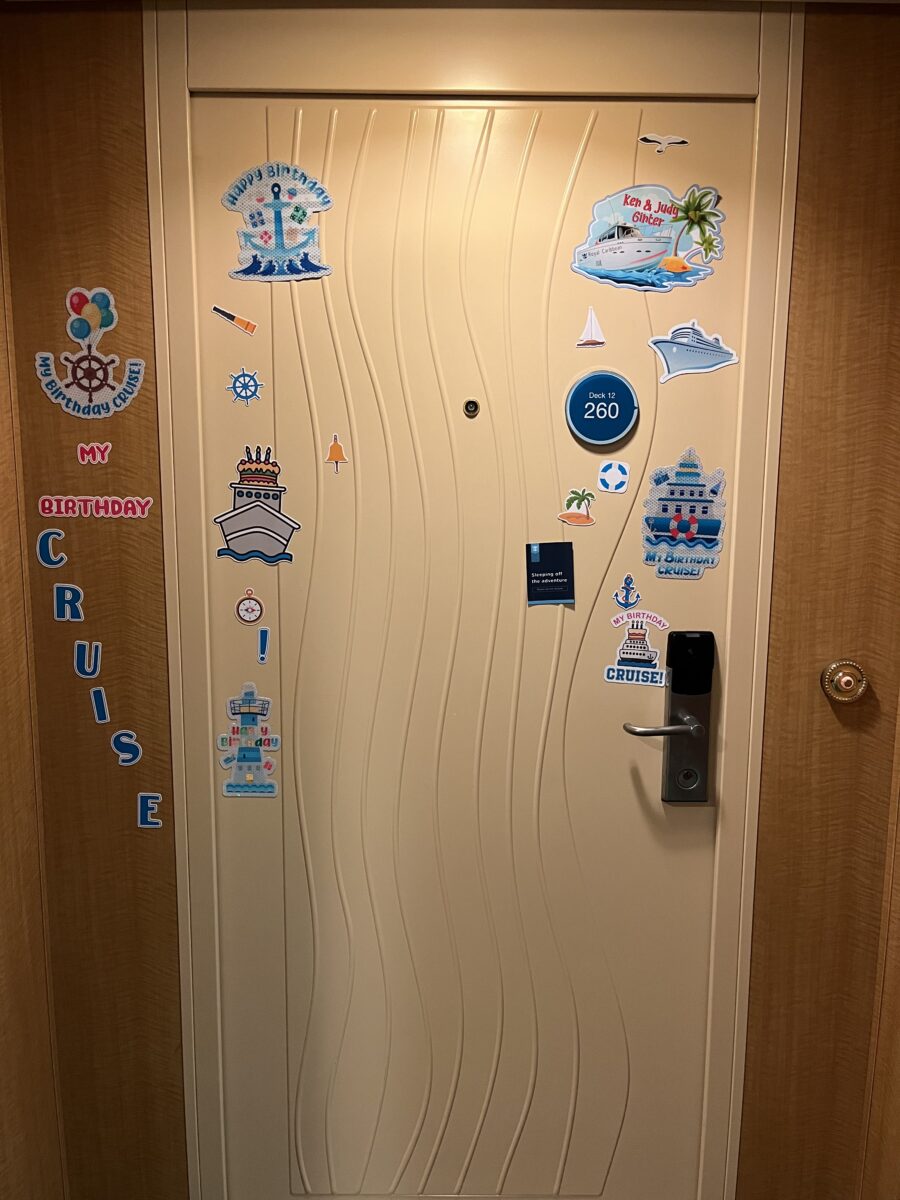 cruise vacation stateroom door with stickers on Oasis of the Seas