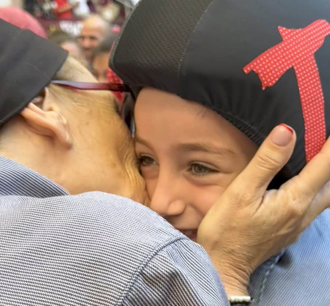 The littlest climber taking a kiss from her grandma after her climb